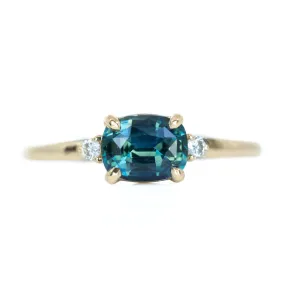 Teal Blue Three Stone Ring featuring 1.15ct cushion sapphire and diamonds in East-West setting