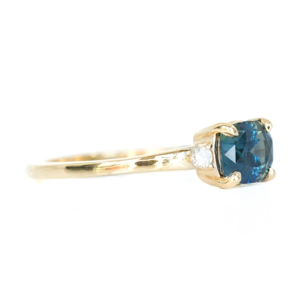 Teal Blue Three Stone Ring featuring 1.15ct cushion sapphire and diamonds in East-West setting